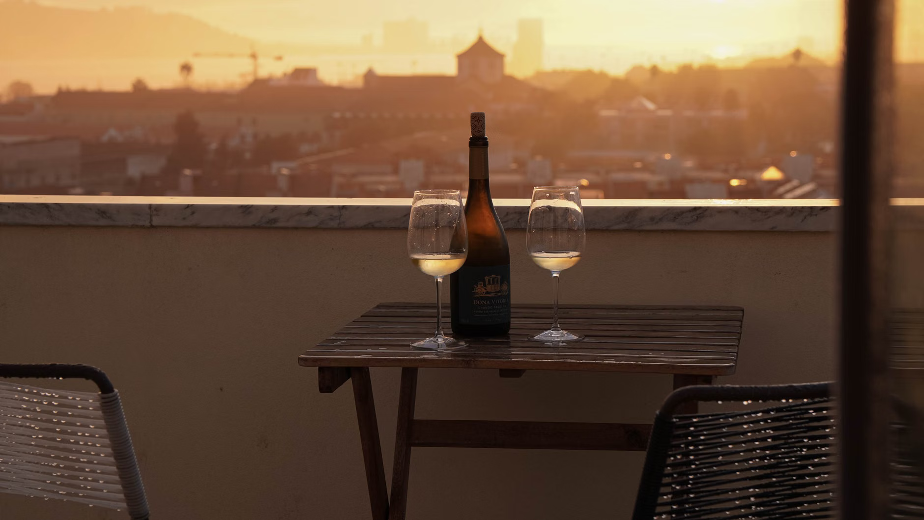 rooftop wine glasses sunset