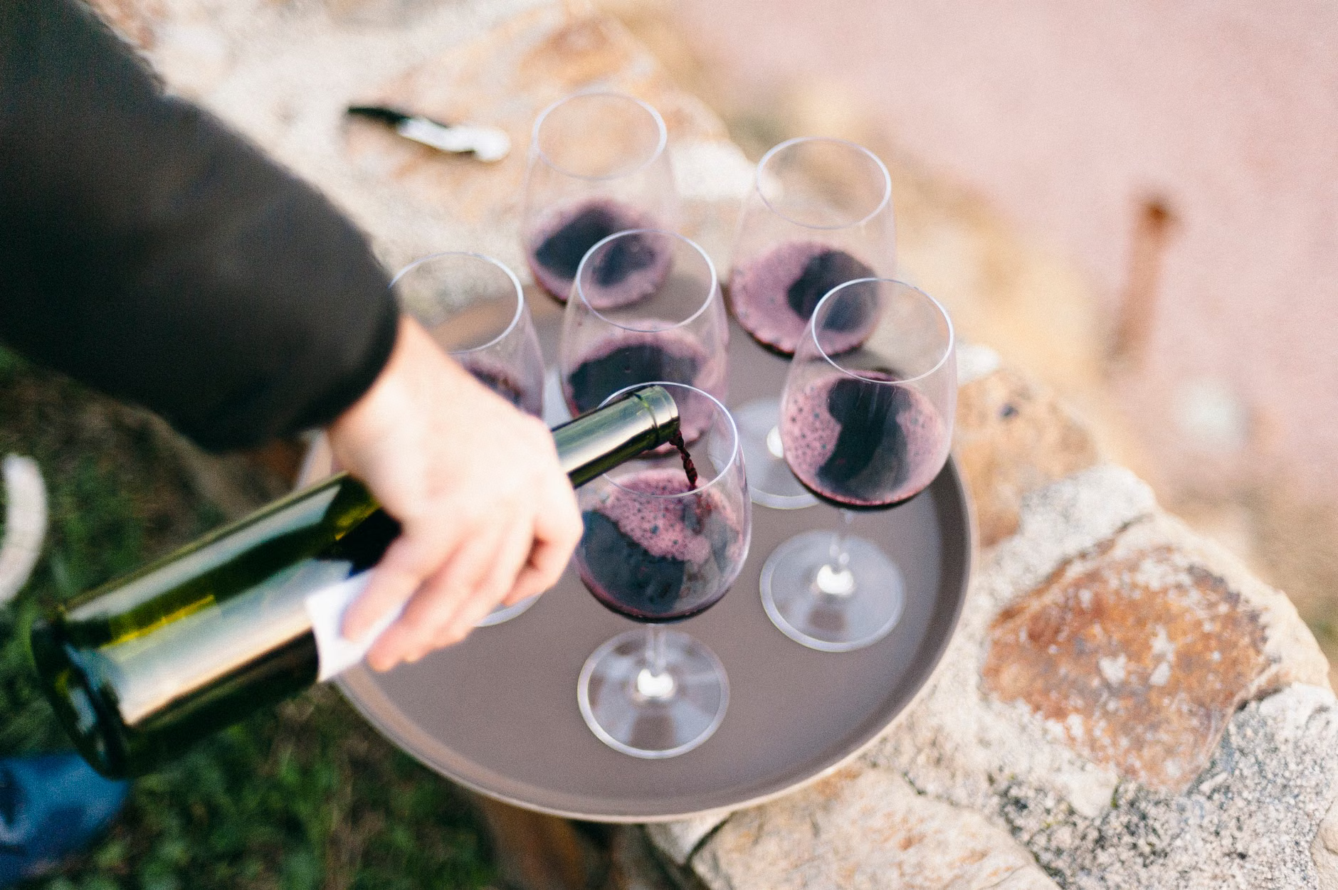 sommelier pouring wine