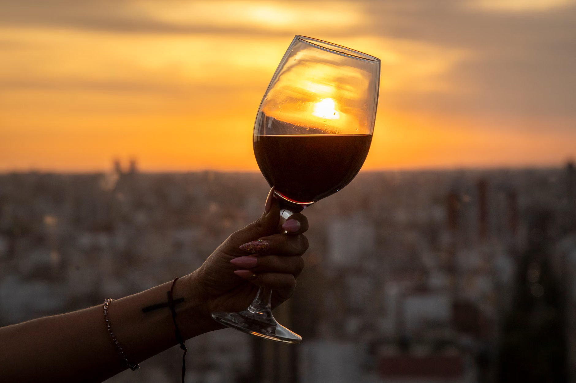 rooftop wine glasses sunset