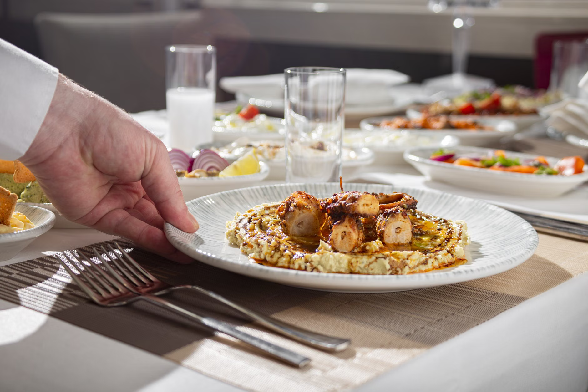 chef serving tasting plate
