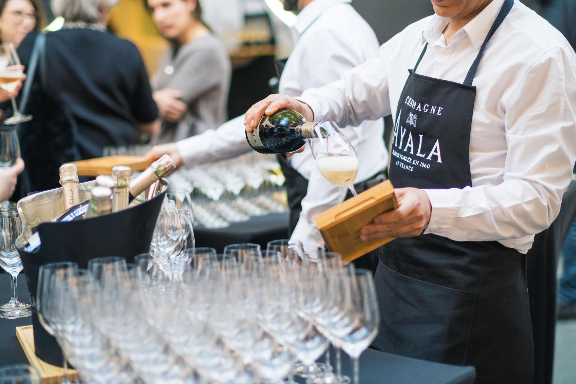 sommelier pouring wine